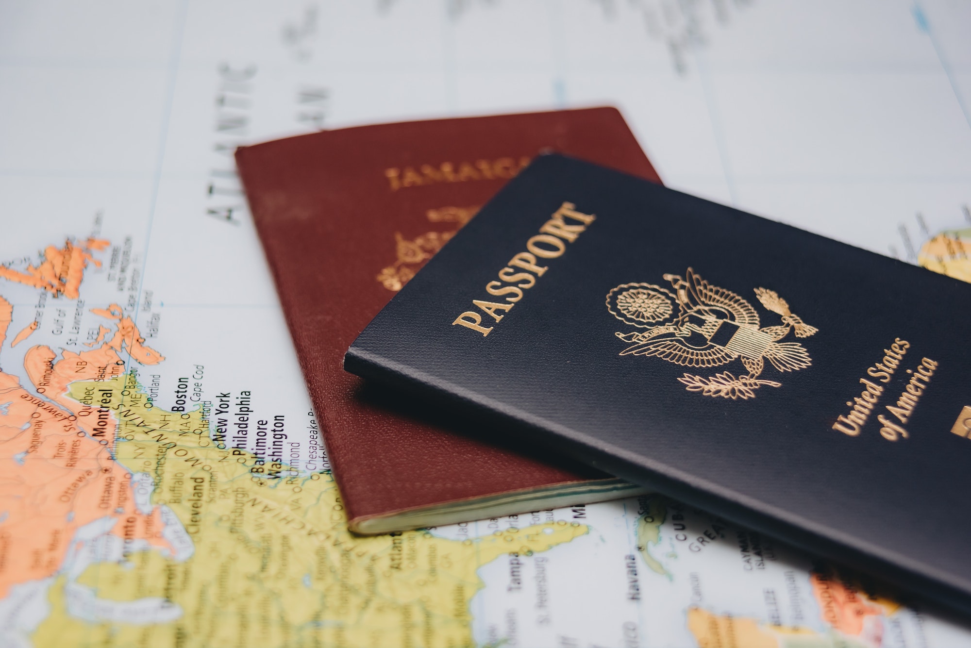 united-states-passport-and-jamaican-passport-on-world-map.jpg